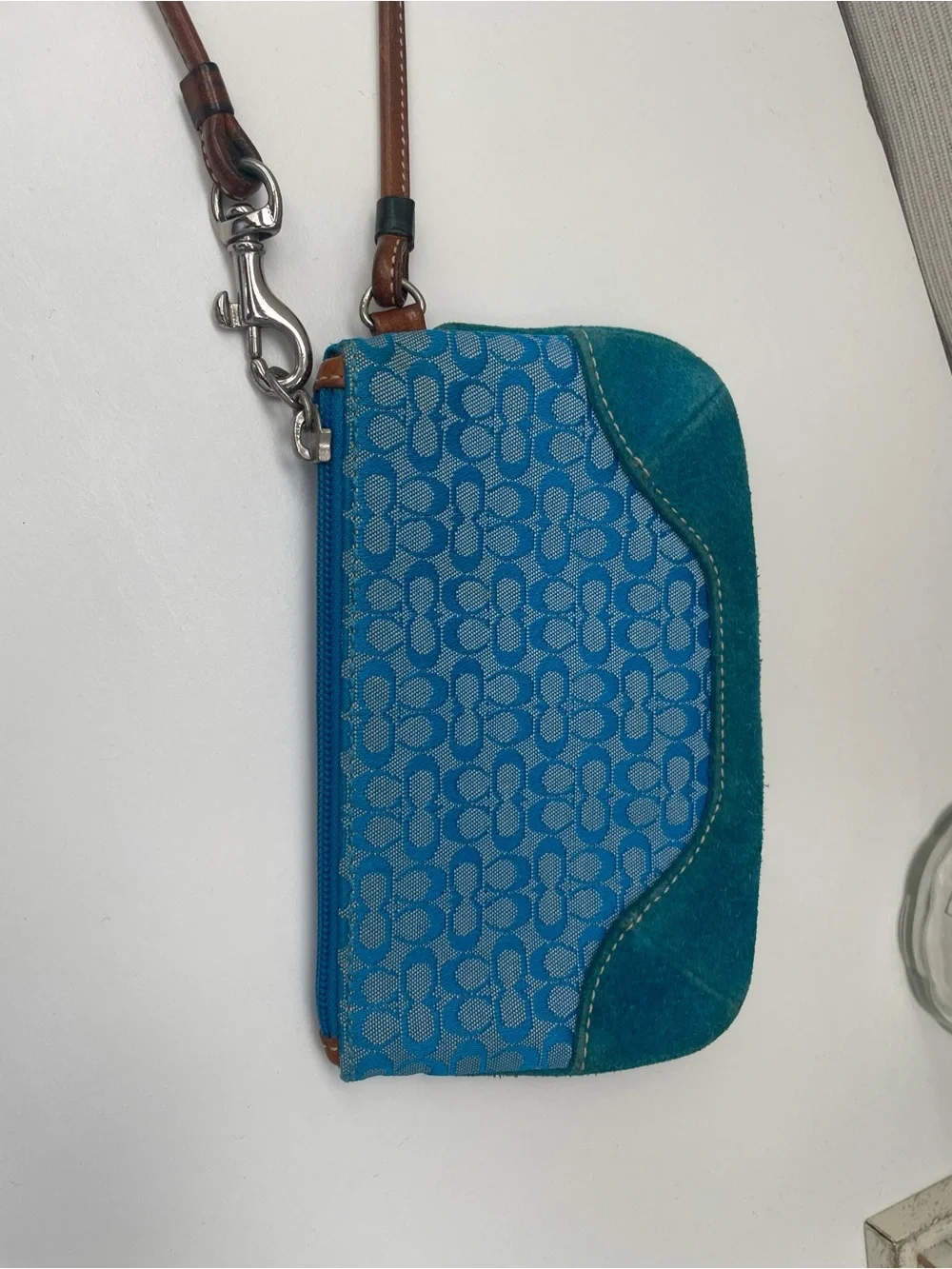 Coach Vintage Wristlet with Suede on the bottom.
